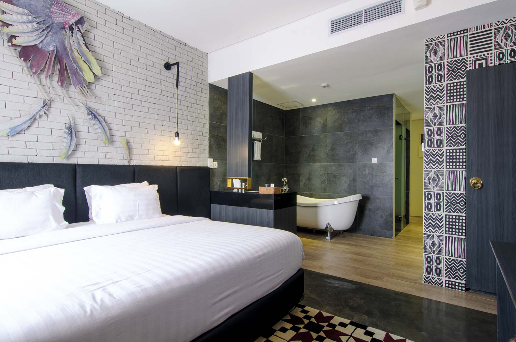 kamar tidur di Couleur Hotel